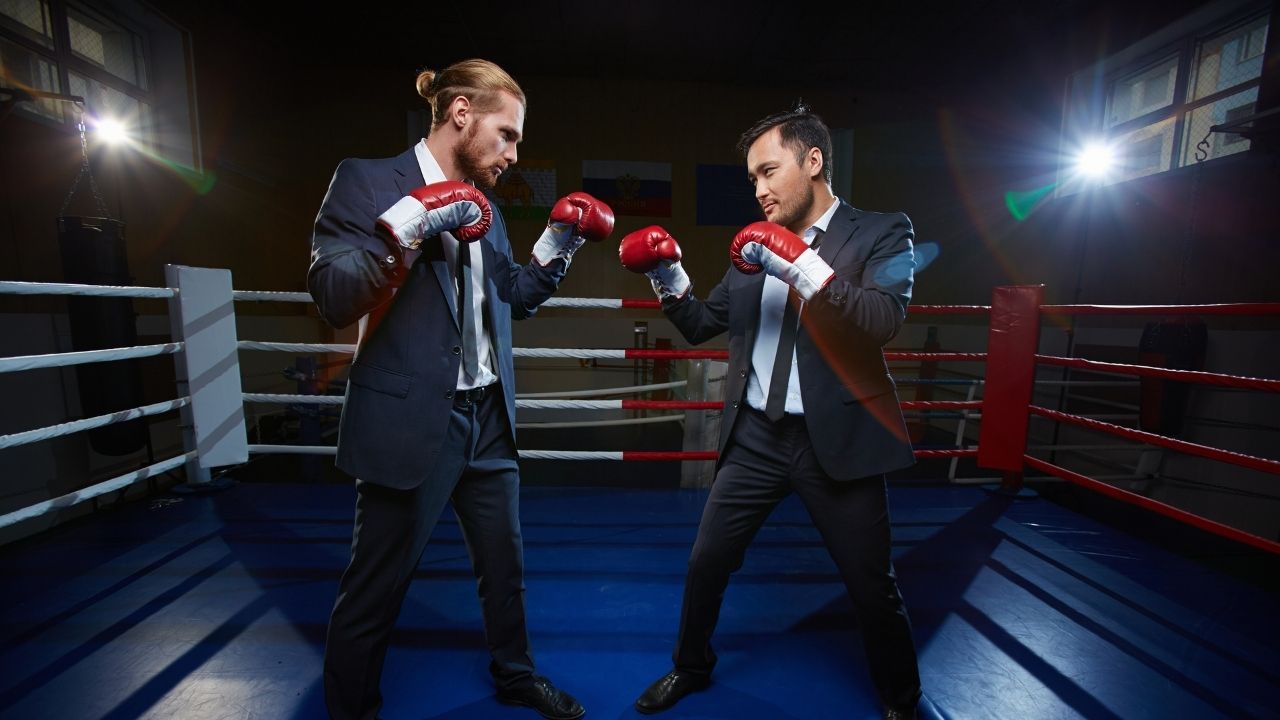 businessmen boxing